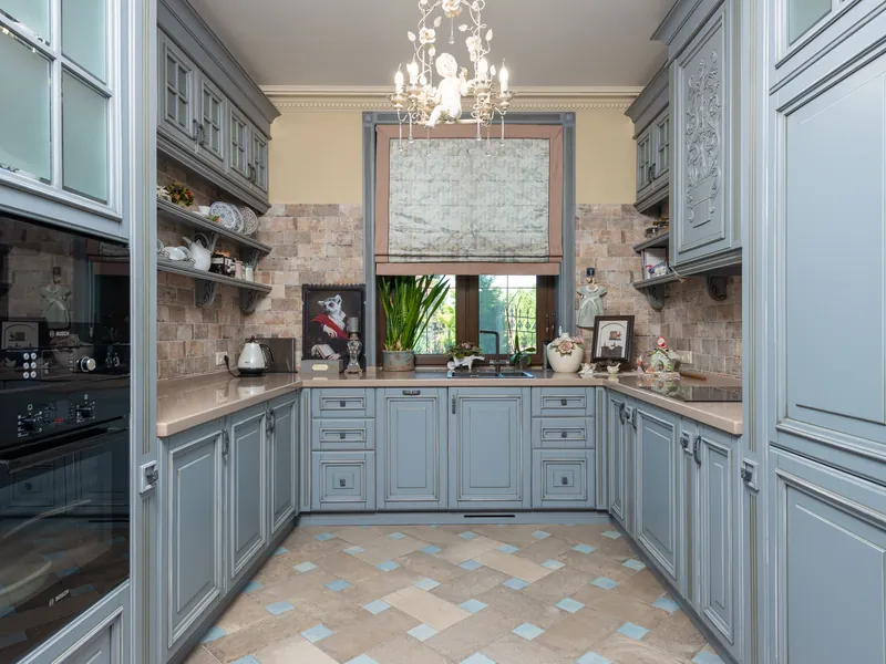 Painted glass-front display cabinets in a Greenville, SC kitchen