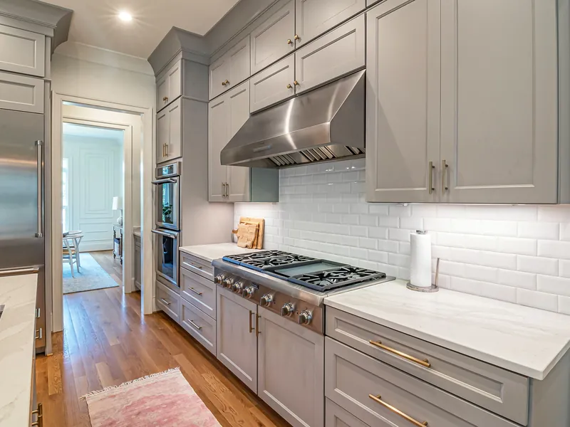 Custom Shaker cabinetry with brass hardware in Greenville, SC