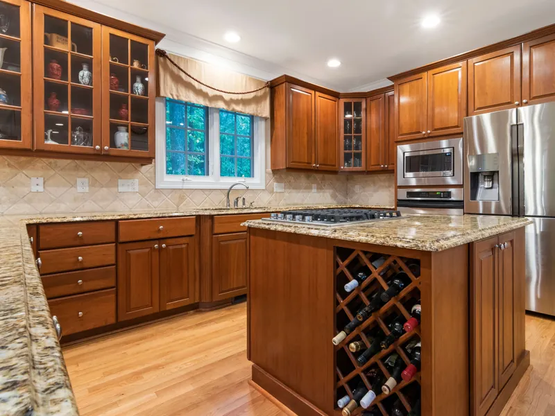 Traditional wood kitchen with glass display cabinets in the Upstate